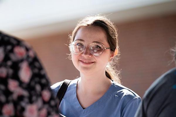 New student talking to friends while on campus